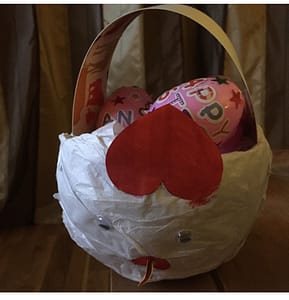paper mache basket and decorated easter eggs stickers