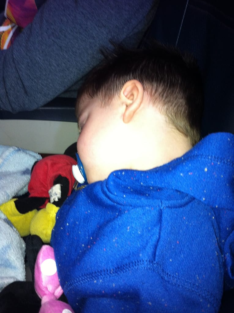 Travelling with babies and toddlers - A tired out Evan on the flight