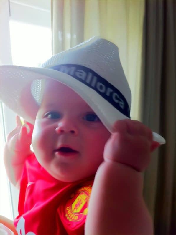 Travelling with babies and toddlers - a 7 month Evan rocking his Mallorca hat